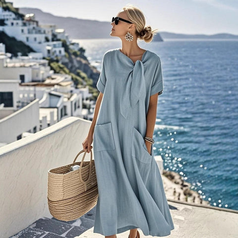 Summer new temperament short-sleeved bow pocket big pendulum loose long dress m302437